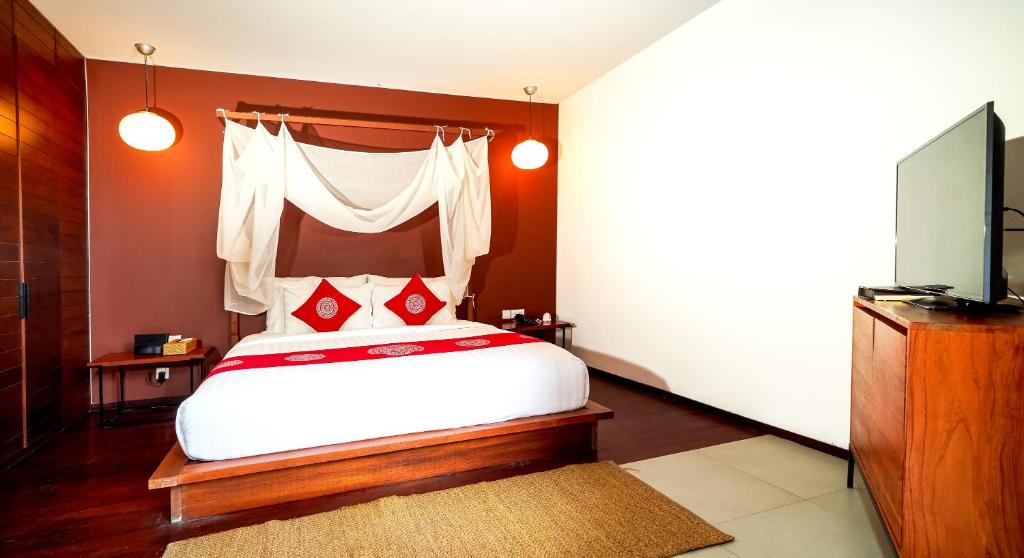 Bedroom with TV at Abia Villas