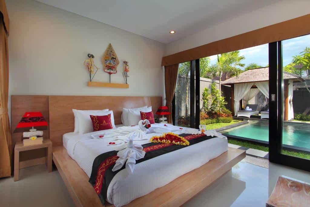 Bedroom with swimming pool at Agata Villas