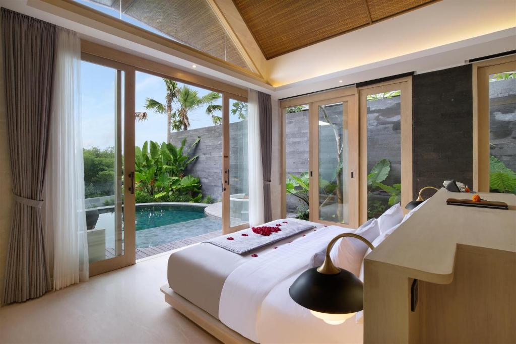 Side bed with pool at Bracha Villas Bali 