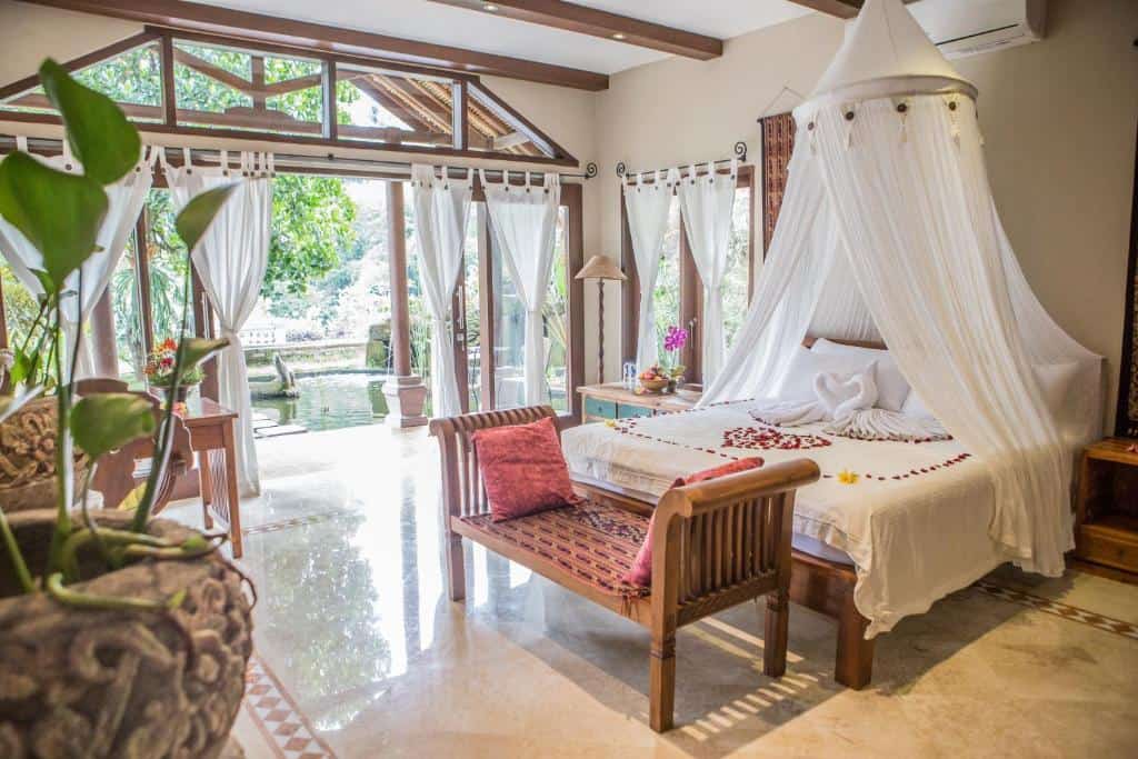 Bedroom with swimming pool at Avalon Ubud Villa