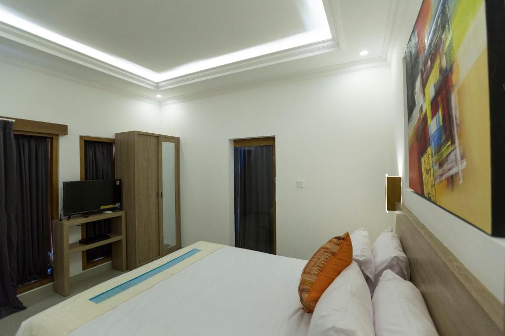 Bedroom with TV at S18 Bali Villas