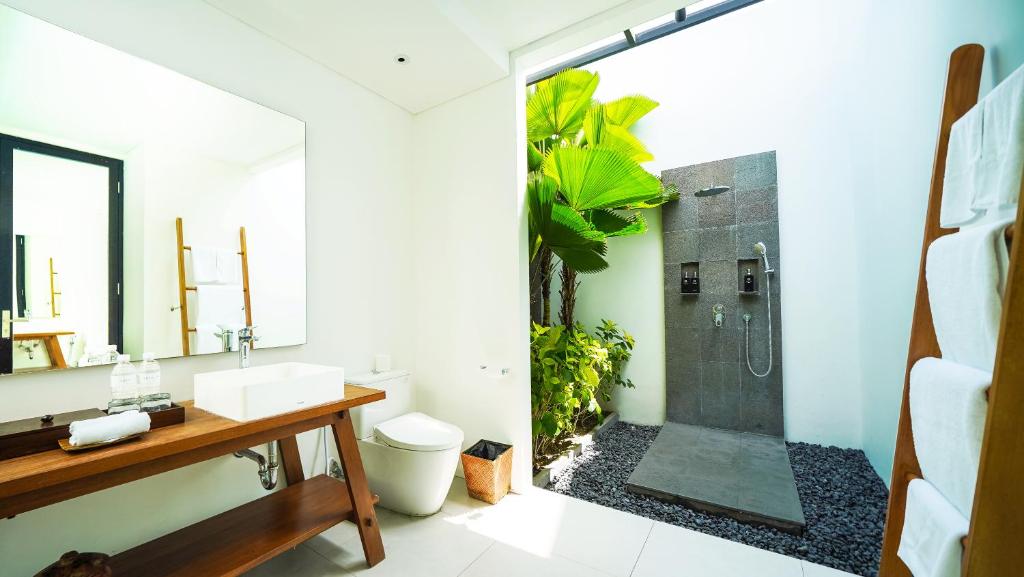 Shower with with wash room at Beautiful Bali Villas