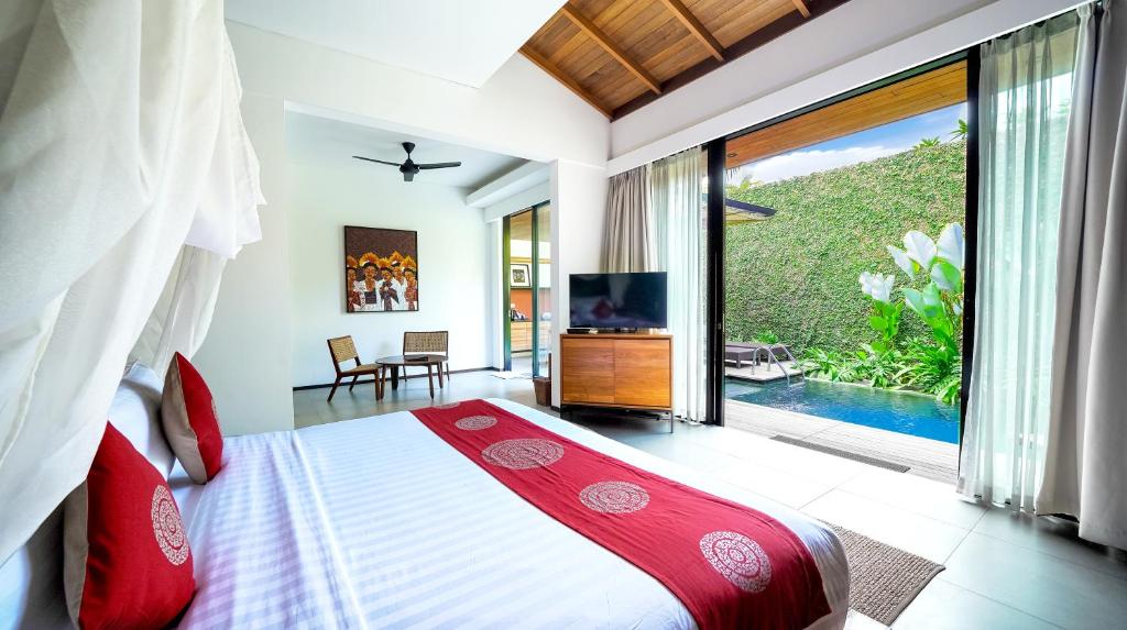 Bedroom with TV at Beautiful Bali Villas
