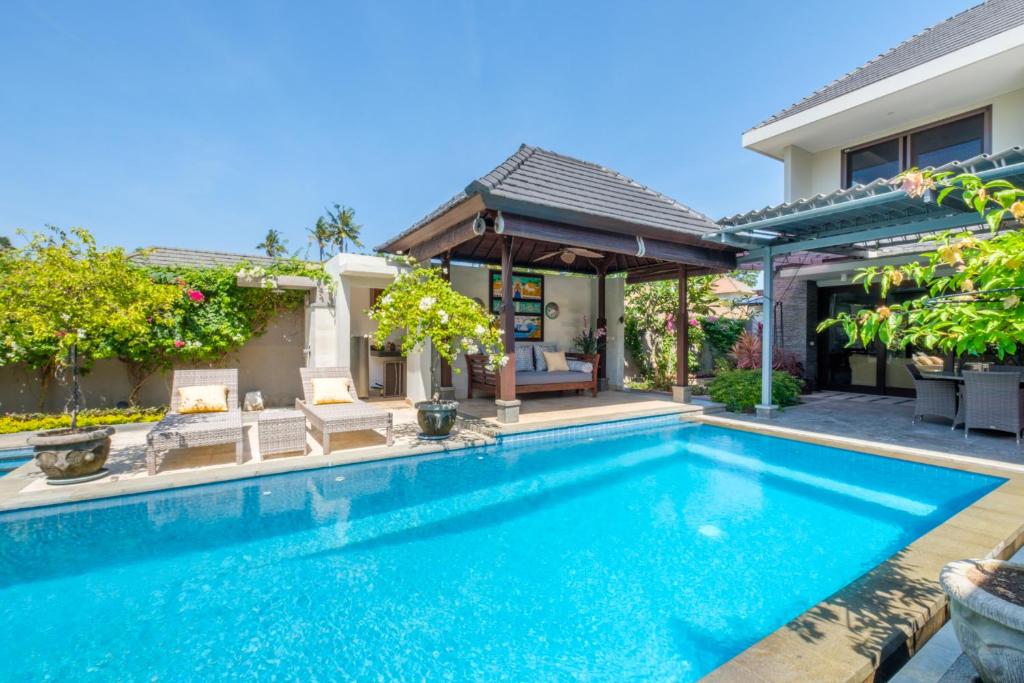 Exterior view of a private pool at Kejora Beachfront Villas in Sanur