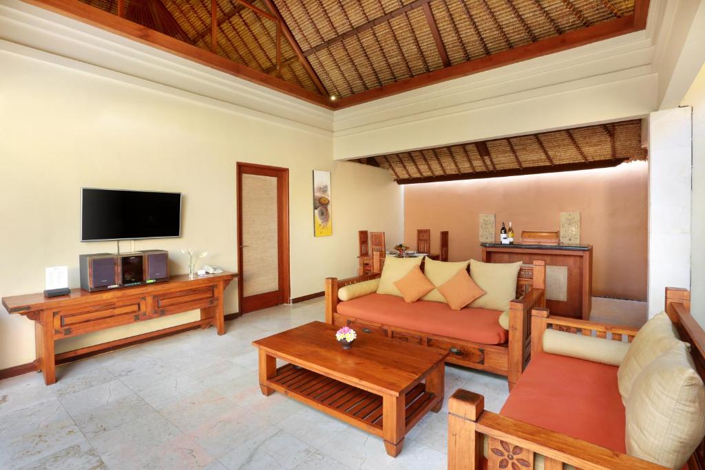Living hall with TV at Bhavana Private Villas