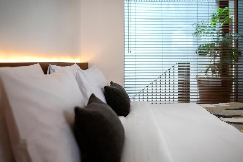 Pillow with Bed at Blossom Eco Luxe Villas 