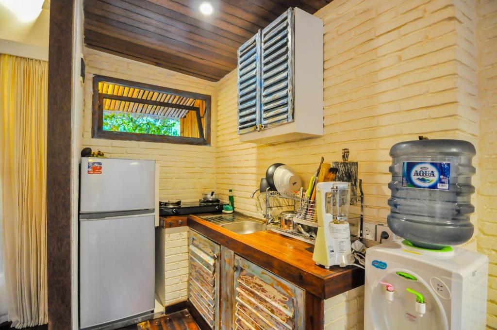 Kitchen with fridge at Eco Green House