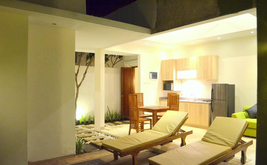 Living hall with fridge at Jas Green Villas and Spa