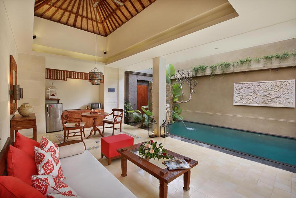 Living hall with pool at Kamajaya Villas