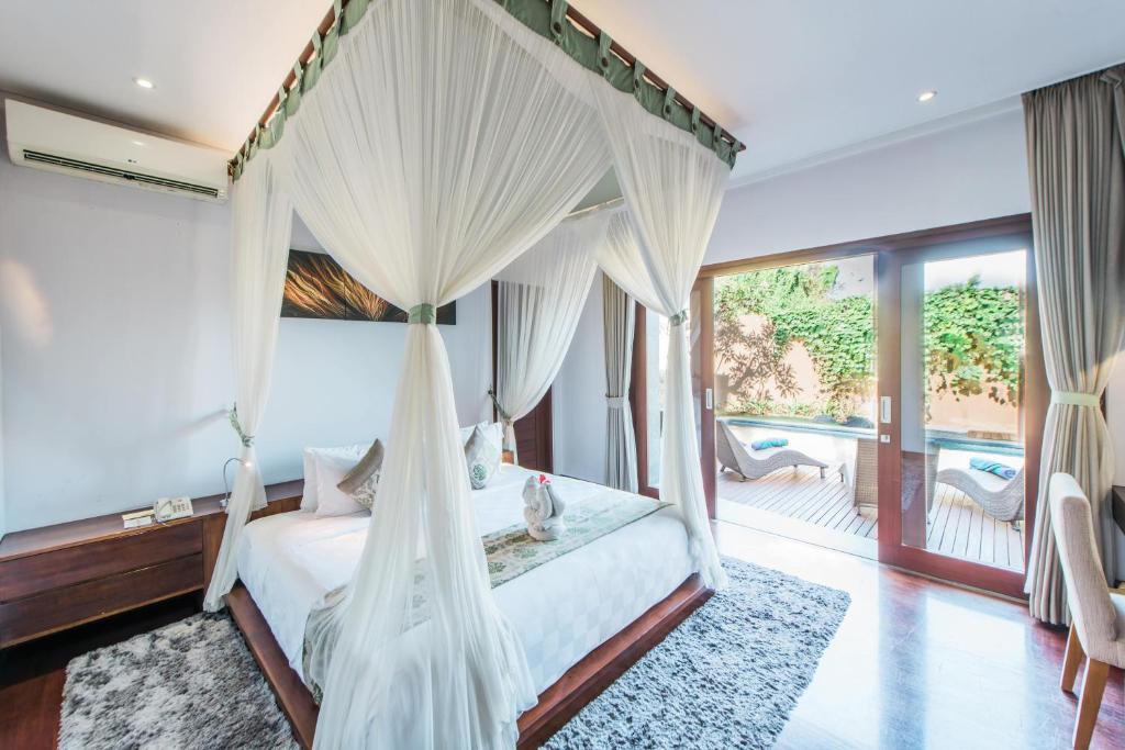 Bedroom with swimming pool at The Kasih Villas 