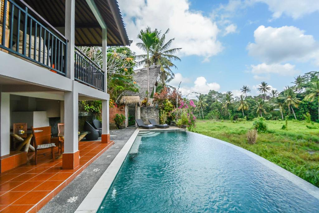 Swimming pool with view at Le Sabot Ubud