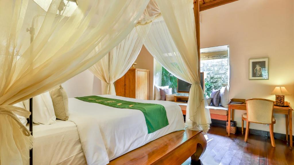 Side bed with TV at DISINI Luxury Spa Villas