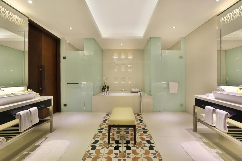 Wash room with towel at Samabe Bali Suites & Villas