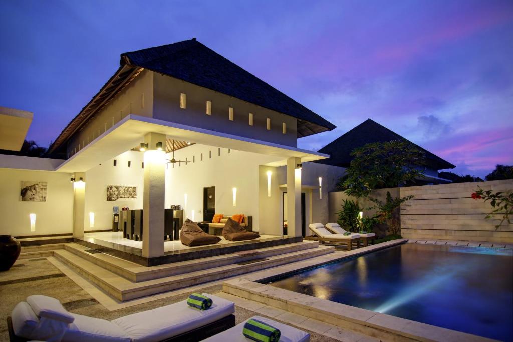 Night exterior view and pool at The Seminyak Suite-Private Villa