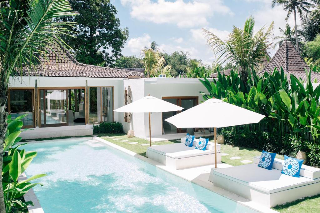 Sun loungers or beach chairs at The Apartments Ubud