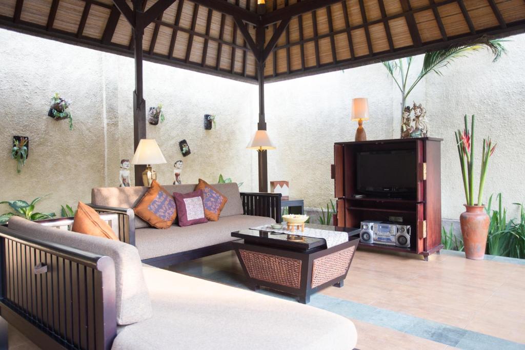 Sofa with TV at The Sanyas Suite Bali
