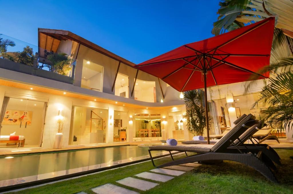 Exterior night view of a private pool at Villa Belle in Seminyak