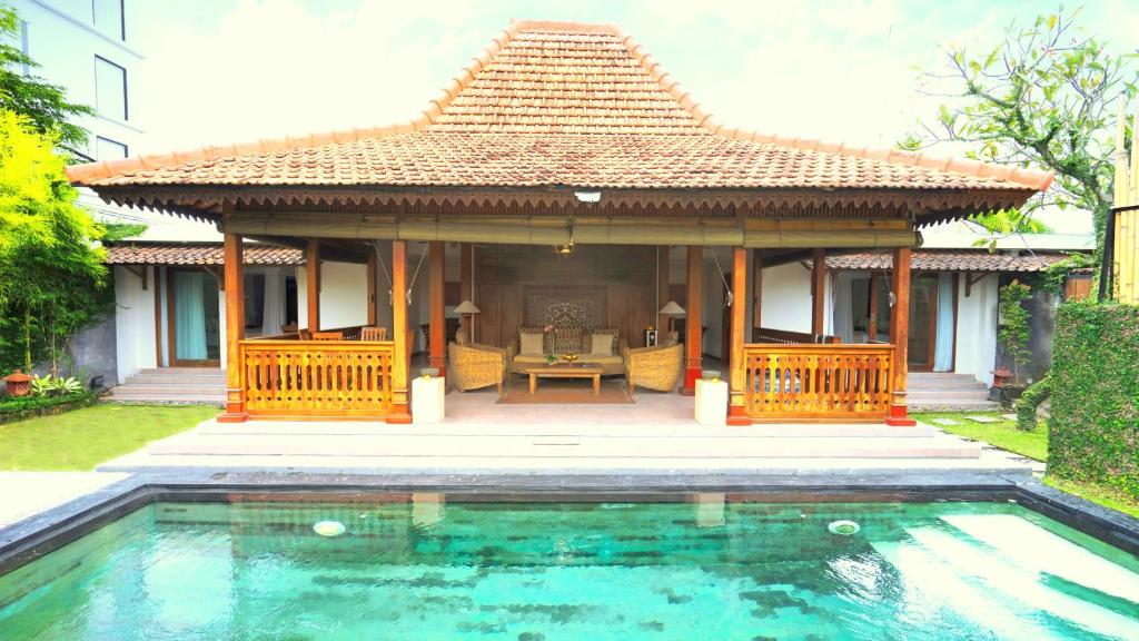 Sun terrace with swimming pool at Villa Berawa