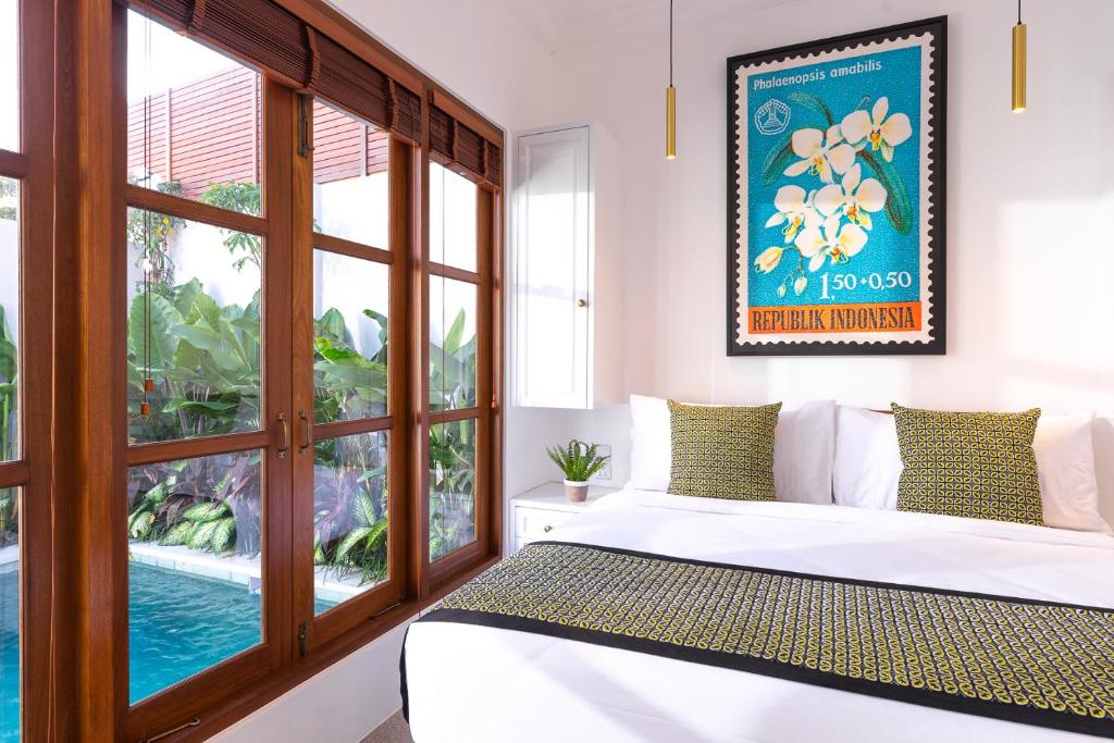 Bedroom with pool at Maylie Bali Villa