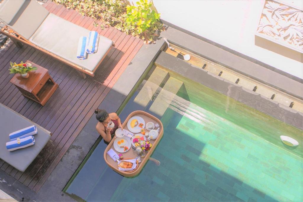 Pool with food at Beautiful Bali Villas