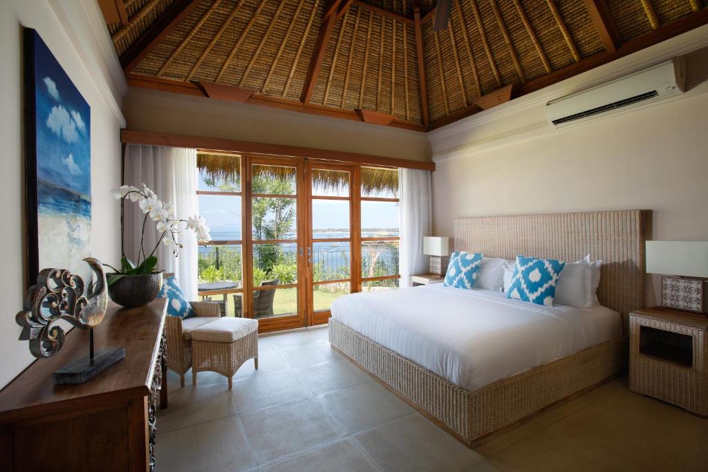 Bedroom with beach at Villa Tanjung