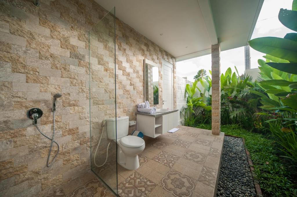 Bathroom with towel at Villa Tirta Padi