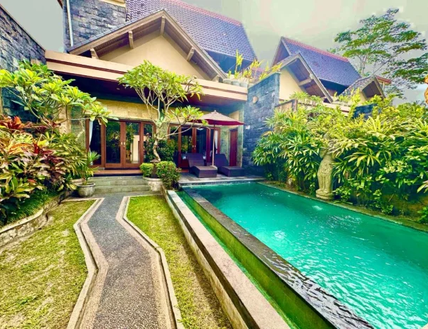 Luxury villa with a private pool and lush greenery