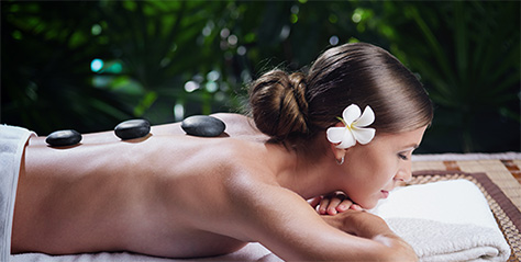 Woman receiving hot stone massage