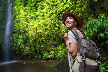 Female backpacker in tropical forest