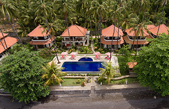 Resort with beachfront bungalows and outdoor pool