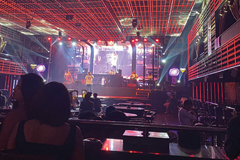Bar interior with glowing red lights and drinks