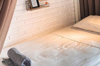 Simple guest room with wooden furniture