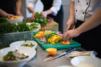 People preparing traditional Balinese food in a cooking class