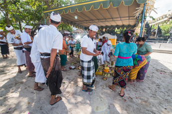 Visitors browsing items at a traditional stall