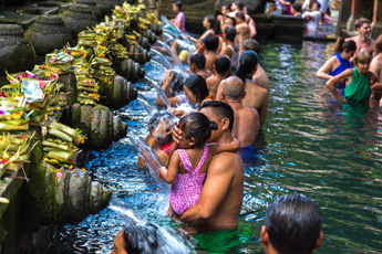 Tourists bathing at a spiritual water purification temple