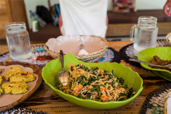 Bowl of noodles and satay at restaurant