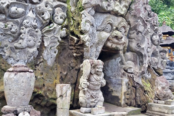 Ancient stone carvings at the entrance of a cave temple