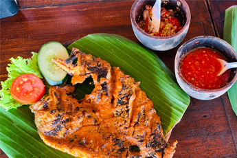 Traditional Balinese food including rice and vegetables