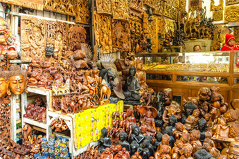Art and craft shop filled with wooden sculptures and paintings