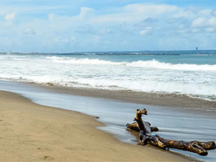 Empty beach with boat near the shoreline