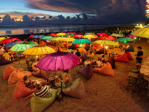 Colorful umbrellas on beach during golden hour
