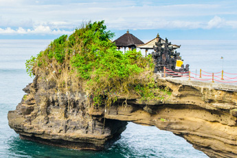 Coastal rock formation with temple on top