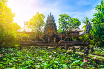 Temple surrounded by a lotus pond and trees