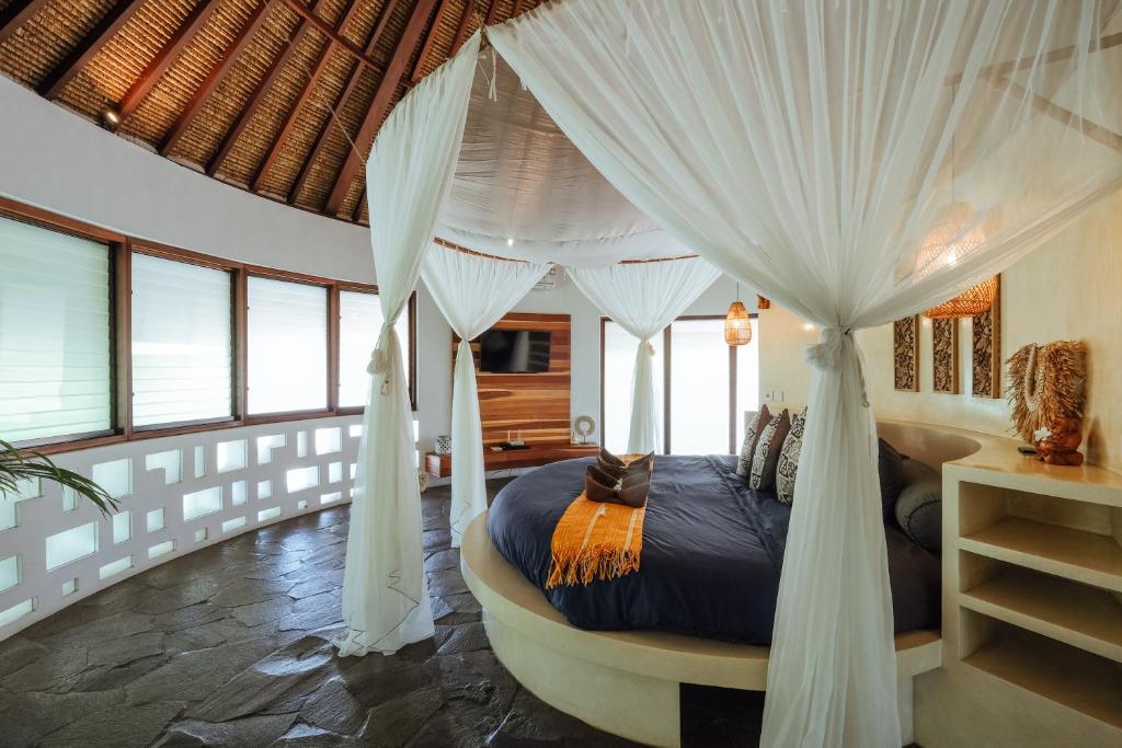 Round canopy bed in rustic villa